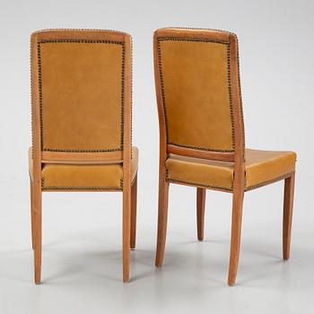 Carl Malmsten, a set of twelve, mahogany and leather chairs. Åfors Möbelfabrik.