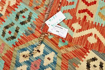 An Afghan kelim runner, c. 301 x 80 cm.