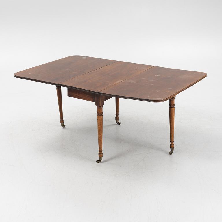 A mahogany dining table, second half of the 19th Century.