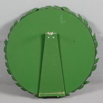 An Estrid Ericson green lacquered pewter mirror, Svenskt Tenn.