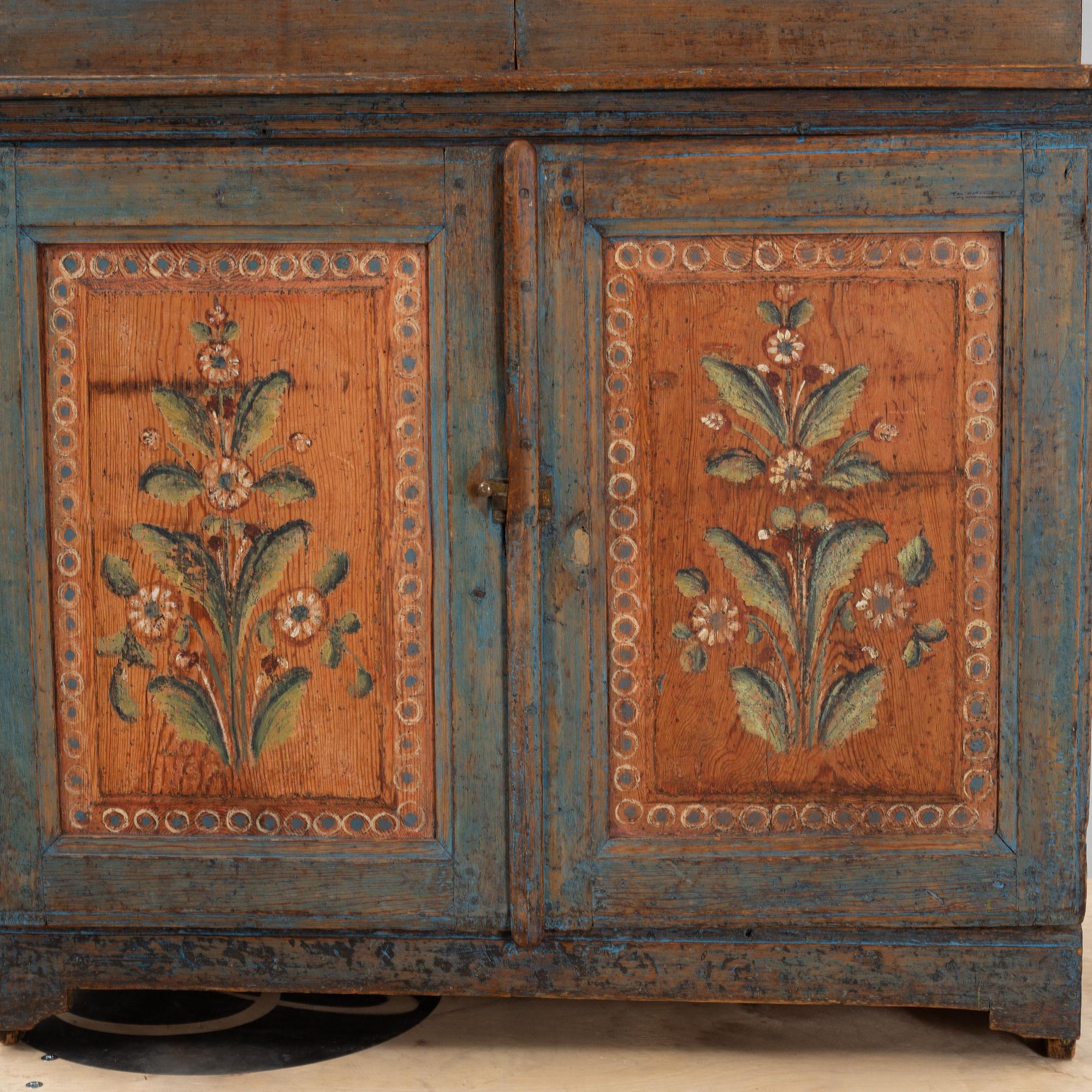 A painted cabinet, dated 1825.