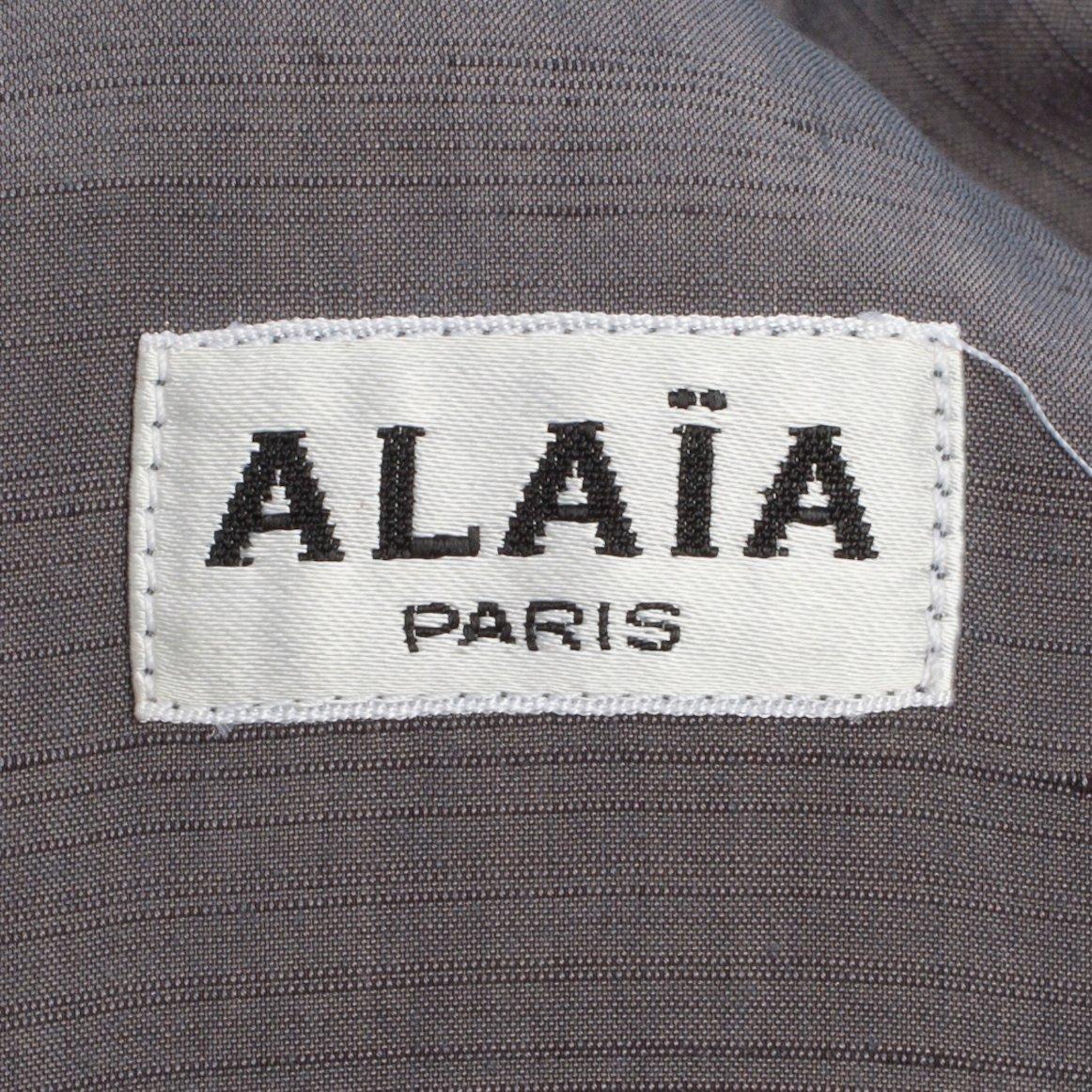 ALAÏA, a grey dress.