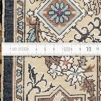 An oriental silk rug, c. 93 x 63 cm.