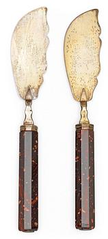 684. A pair of Swedish Empire 19th century porphyry and silver knives.