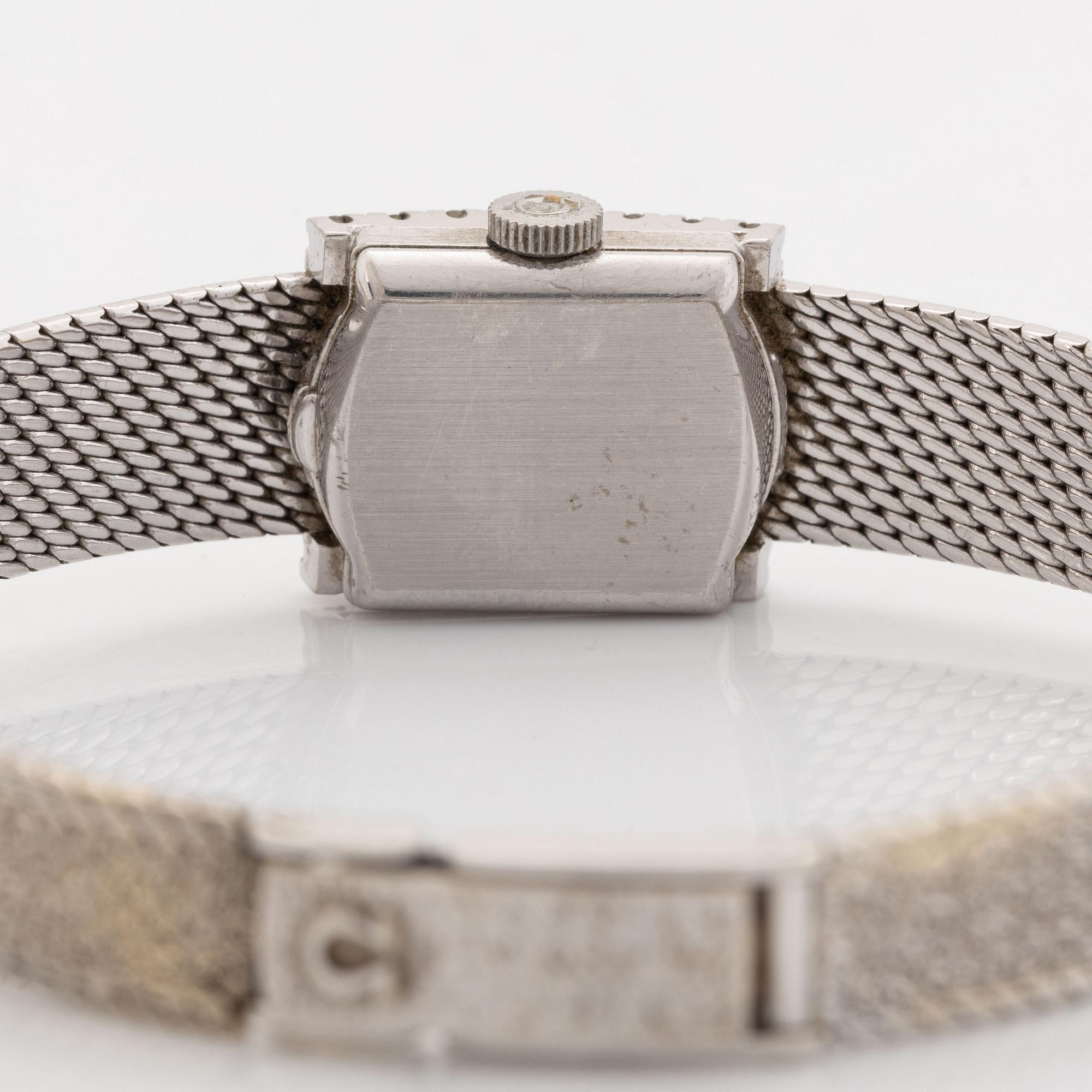 Omega, armbandsur, 18K vitguld med briljantslipade diamanter.