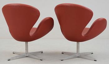 An Arne Jacobsen red leather 'Swan' chair, Fritz Hansen, Denmark 2001.