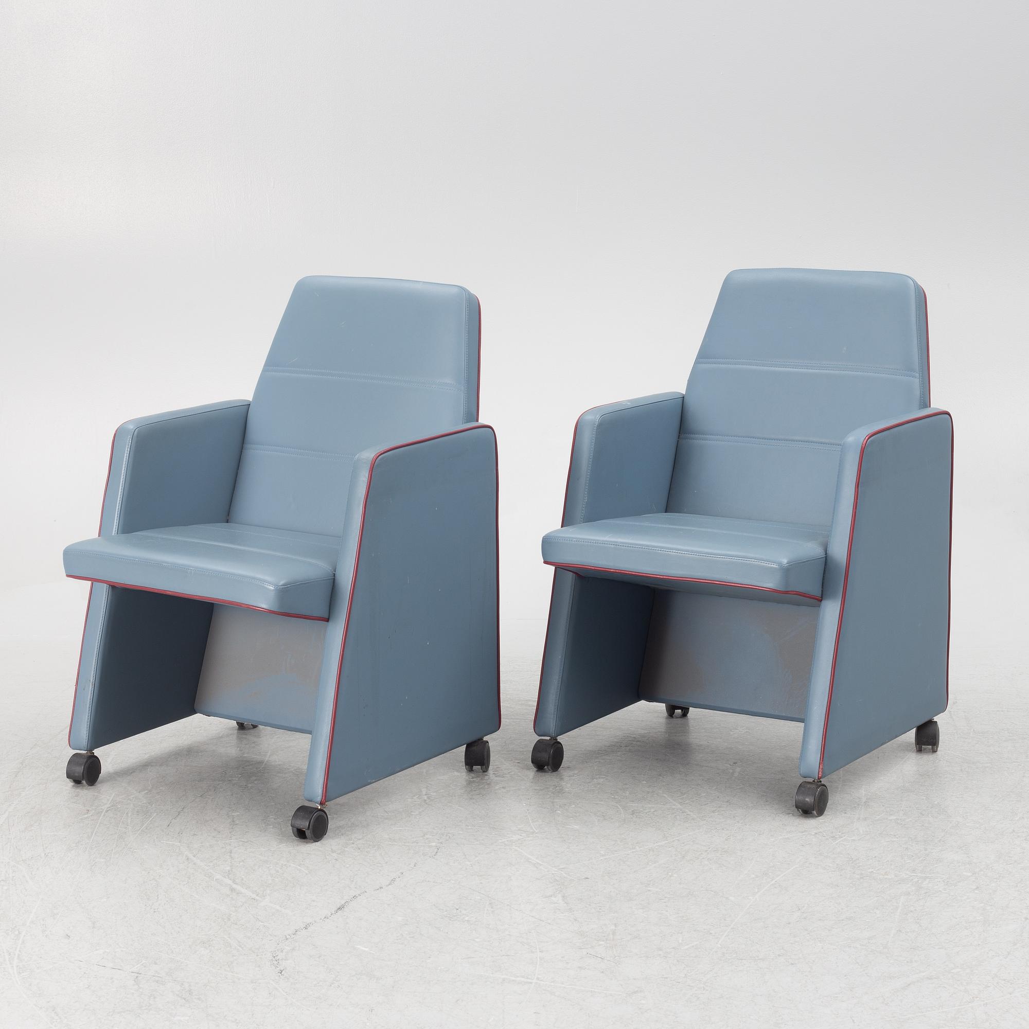 A pair of 1980s armchairs.