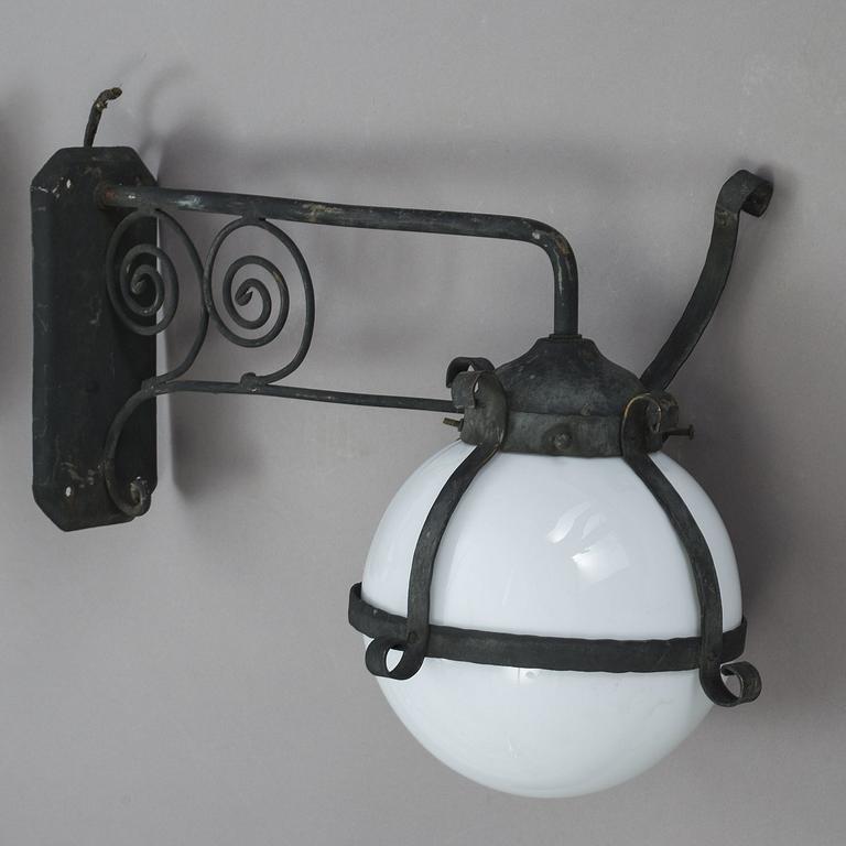 A pair of 1920's copper and glass outdoors wall lights.