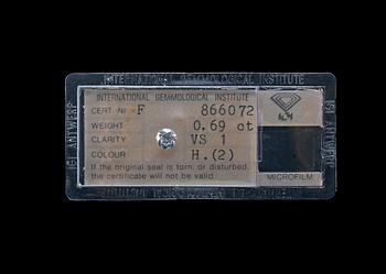 507. A DIAMOND, brilliant cut 0.69 ct. H/vs1 . IGI certificate 1980.