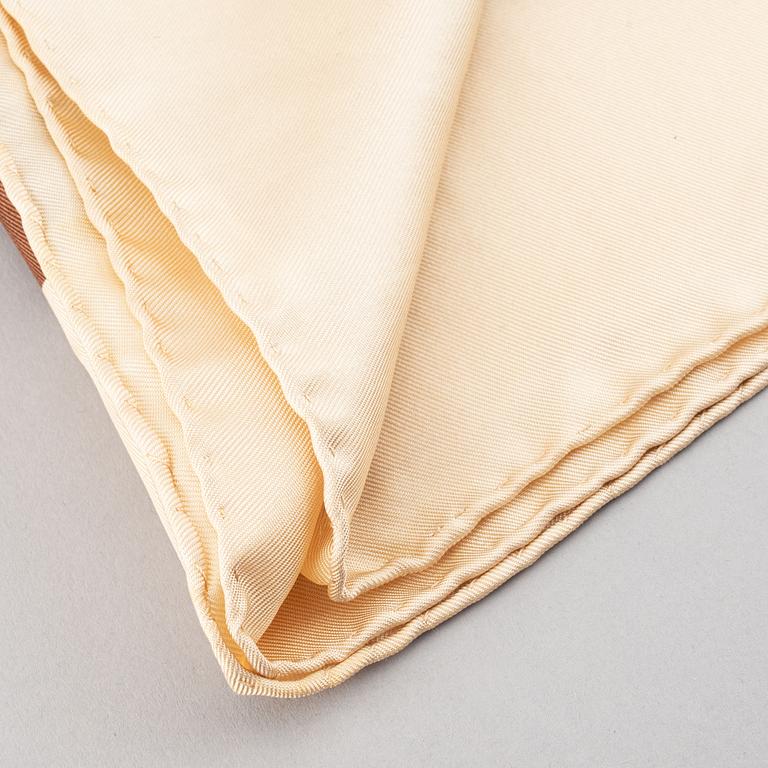 Louis Vuitton, a silk scarf.
