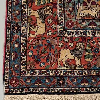 A CARPET, a semi-antique Teheran figural, 303,5 x 198-205,5 cm.