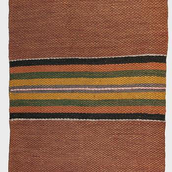 A 1930/1940s rag rug /runner. Circa 550 x 74 cm.