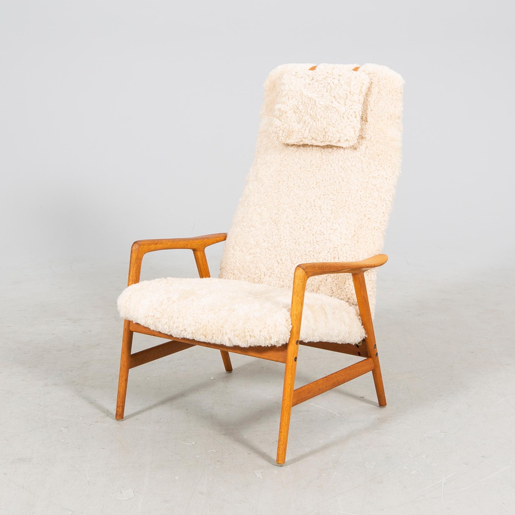 An Alf Svensson Contour-Set 327 sheepskin armchair.