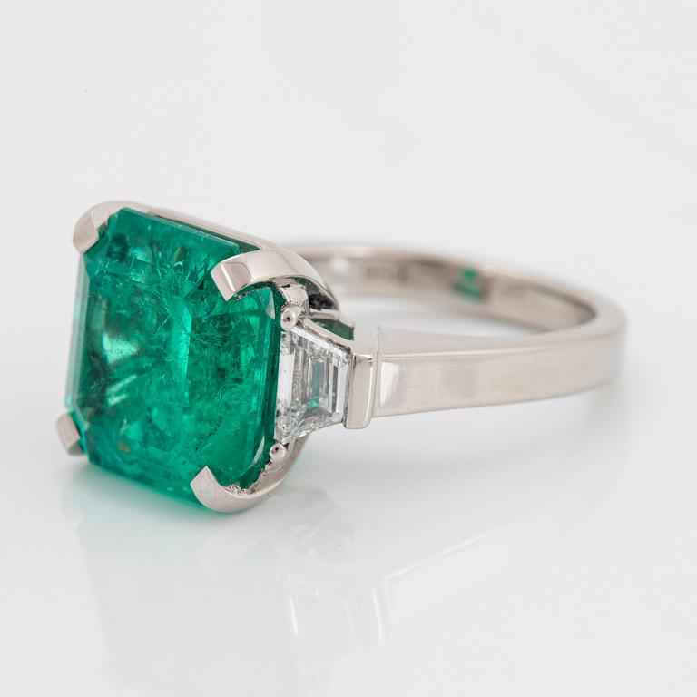 A platinum ring set with a Colombian emerald weight ca 10.40 cts.