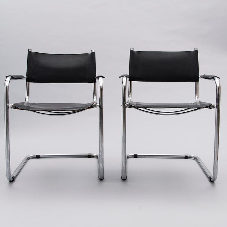 A Set of Three Chrome and Black Leather Chairs.