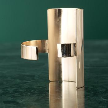 A bracelet by MARTIN MARGIELA.