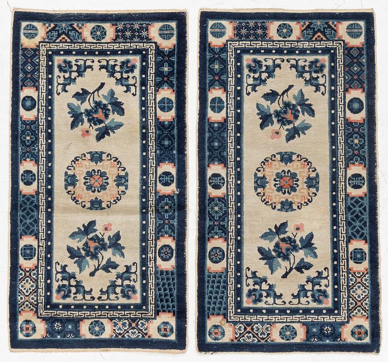 A pair of Baotou rugs, China, c. 120 x 64 cm.