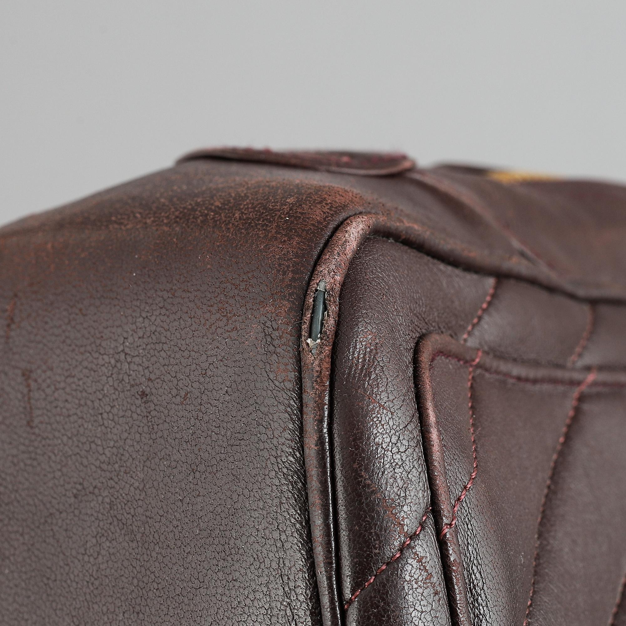 Chanel, a burgundy leather handbag, 1989-91.