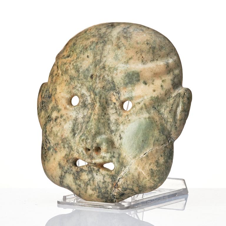 A Japanese sculptured face mask, Edo period (1603-1868).