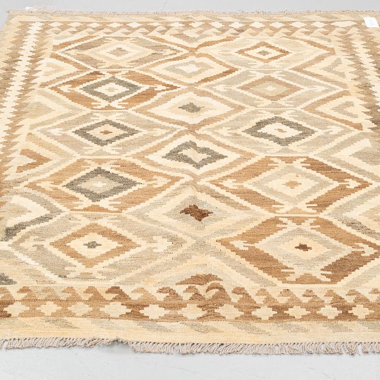A rug, kilim, around 199 x 157 cm.