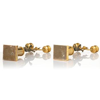 A pair of Empire gilt-brass two-branch candelabra, Stockholm, early 19th century.