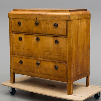 A mid 19th century chest of drawers veneered with birch.