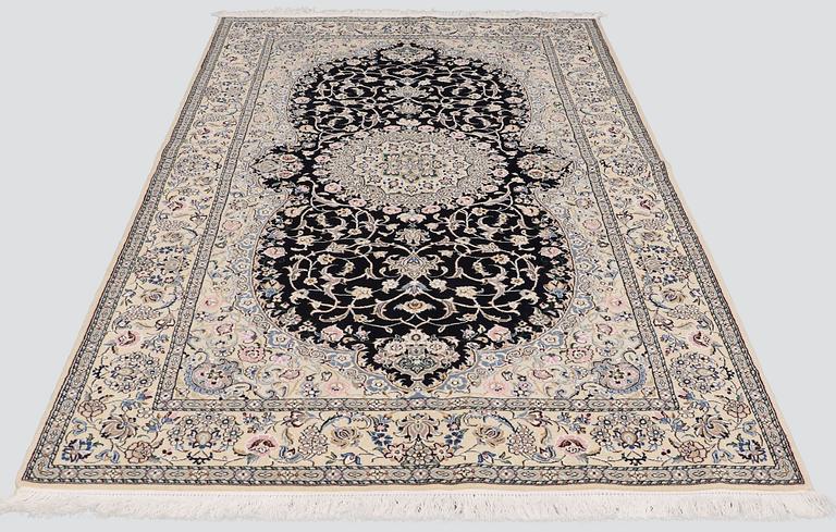 A carpet, Nain part silk, S.K 9 LAA, 246 x 150 cm.