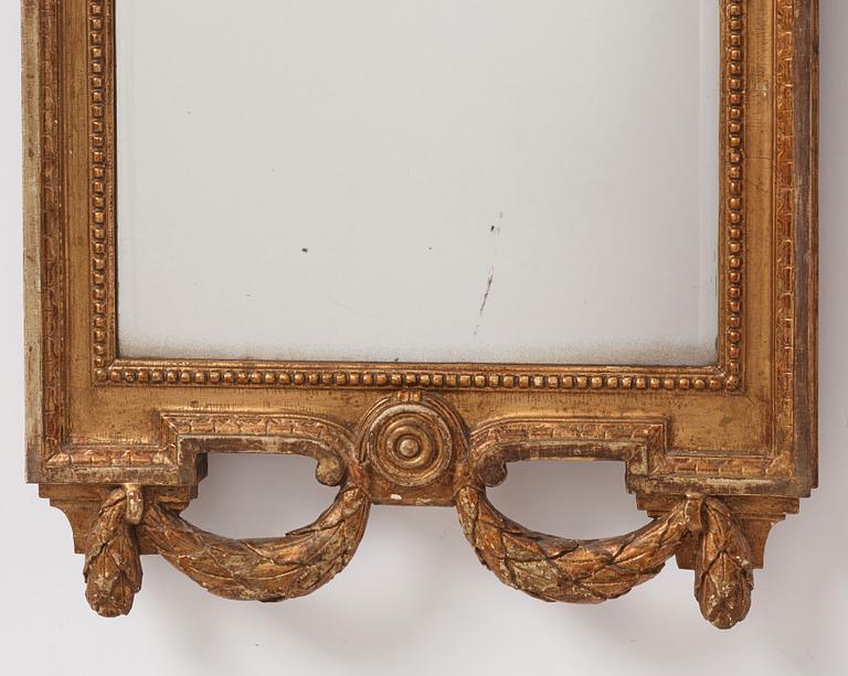 A Gustavian giltwood mirror by J. Åklerblad (active 1756-1799) and A. Öberg (1781-1791).
