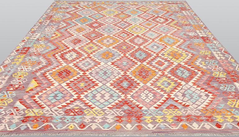 A kilim carpet ca 338 x 256 cm.