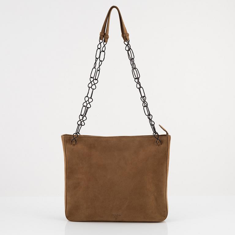 Prada, a tan suede bag.