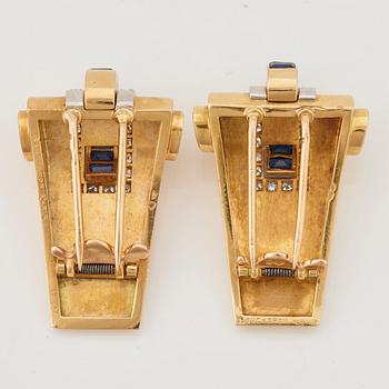 A pair of 1940/50's brooches by Boucheron, set with baguette cut sapphires, brilliant- and single cut diamonds.