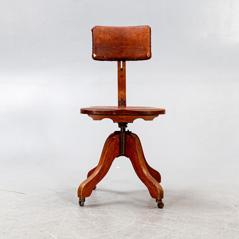An early 1900s oak office chair.