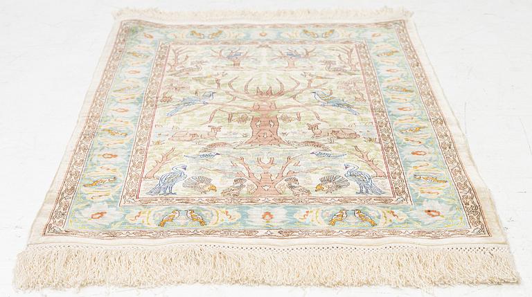 A figural silk Hereke rug, c 65 x 47 cm.