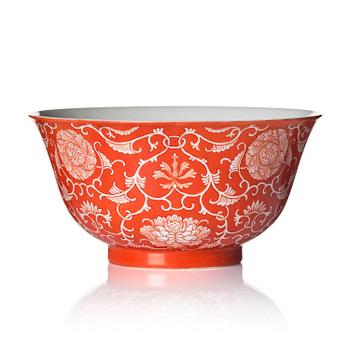 1048. A coral red reserve decorated floral bowl, Qing dynasty with Qianlong mark.