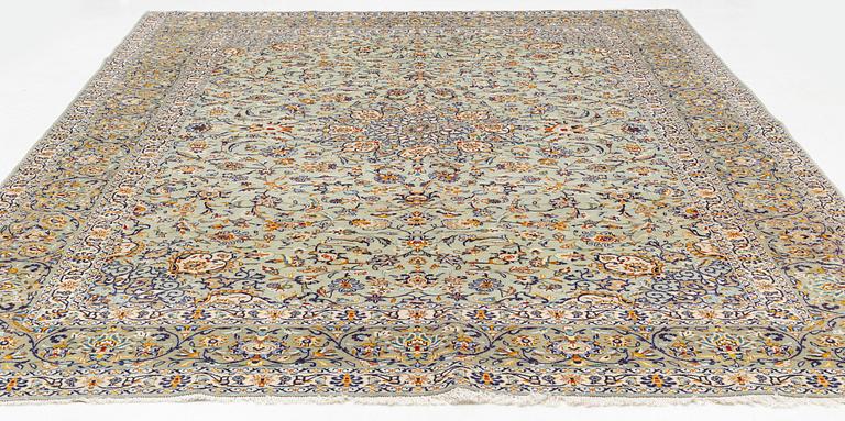 A Keshan carpet, signed, c. 410 x 297 cm.