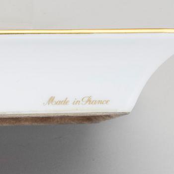 A Hermès porcelain ashtray.