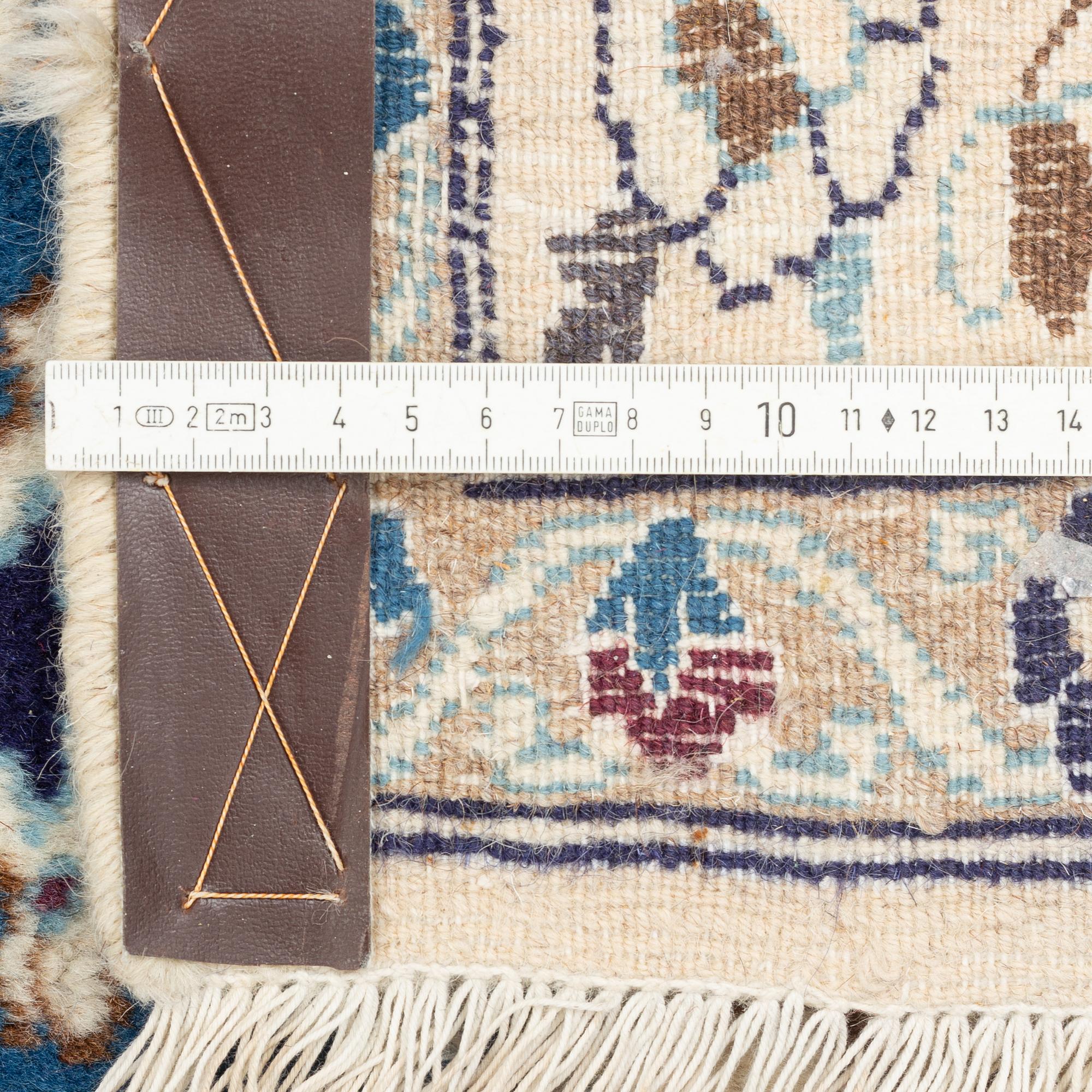 A Nain carpet, circa 310 x 196 cm.