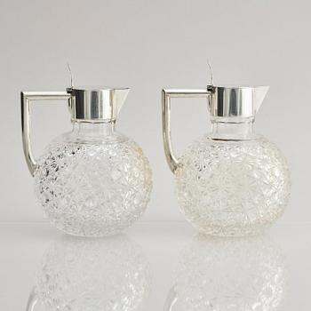 A Swedish pair of silver and cut-glass decanters, mark of C.G. Hallberg, Stockholm 1893.