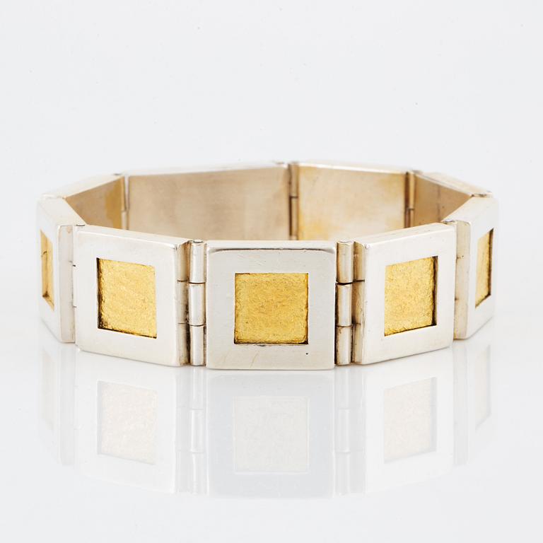 A Michael Hamma bracelet in silver and 18K gold.