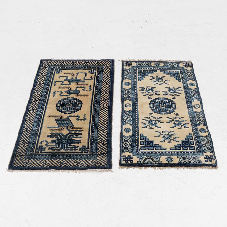 Two antique Chinese Pao-Tow rugs, c. 125 x 65 and 125 x 60 cm.