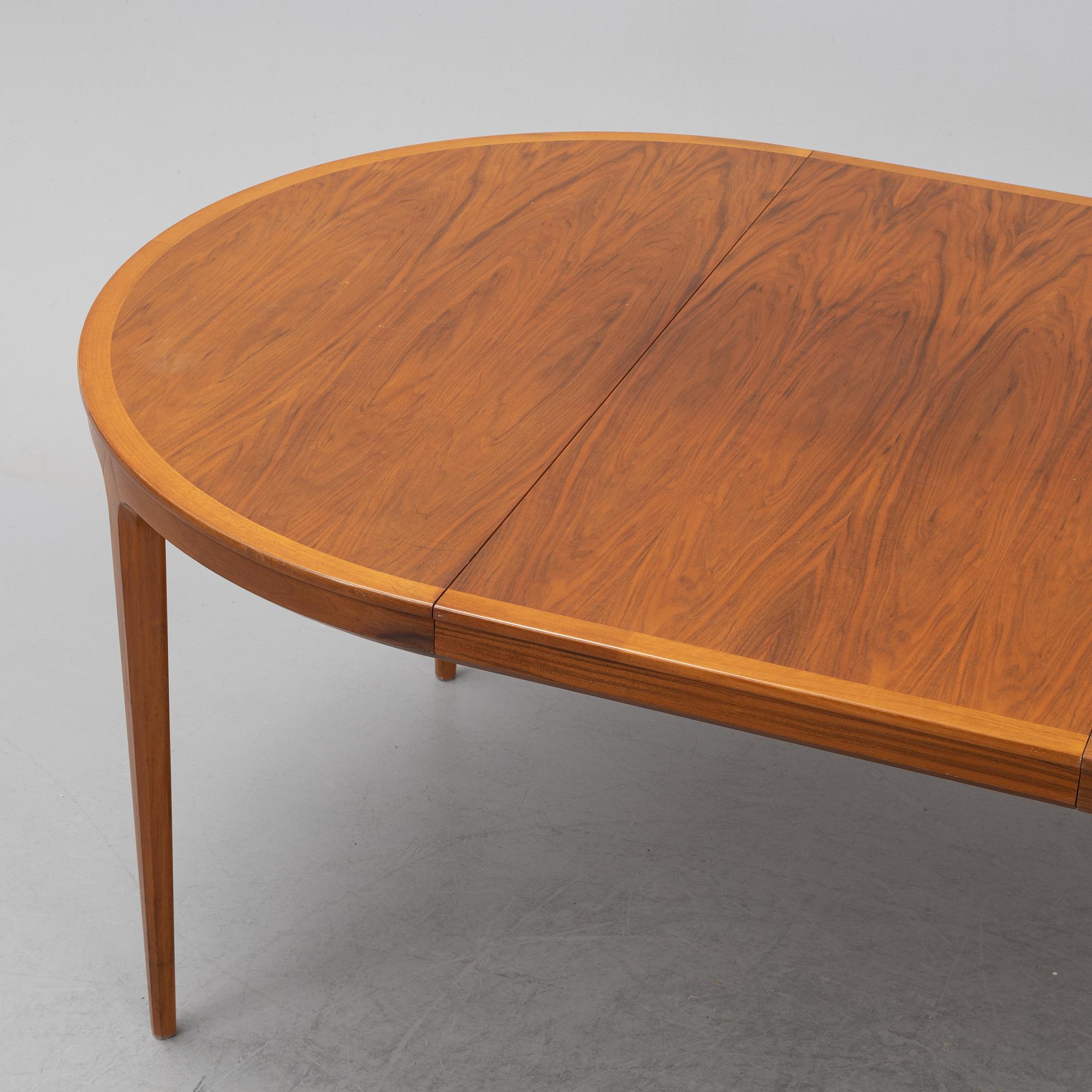Bertil Fridhagen, a 'Diamant' walnut veneered dining table, with four additional leaves.  Bodafors.