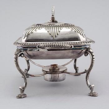 A silvered metal serving dish with rechaud, first half of the 20th century.