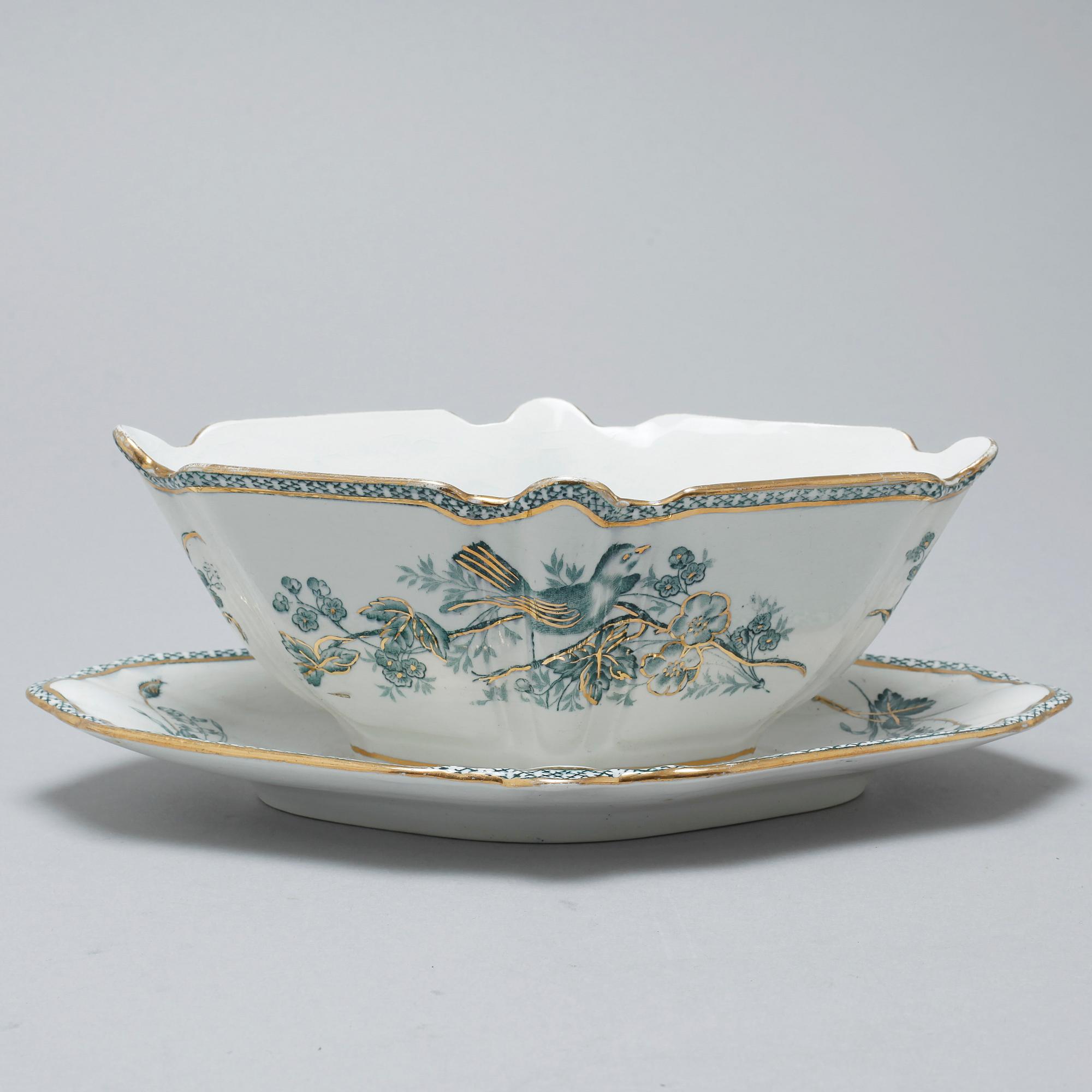 A earthenware table set of 136 pcs "Vexiö Guld",  by Arvid Ekberg, Gustafsberg, from around year 1900.