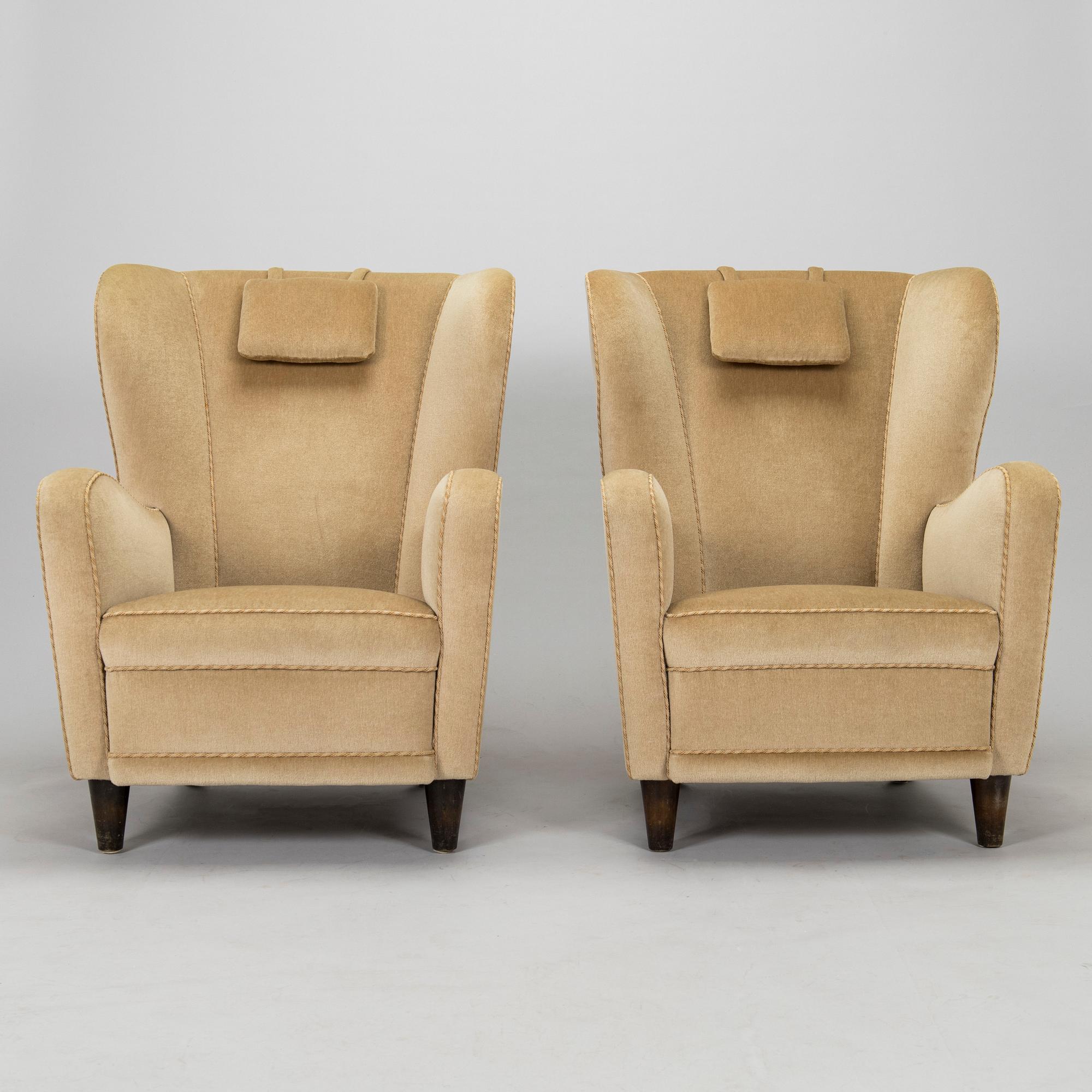 A pair of mid-20th century armchairs.