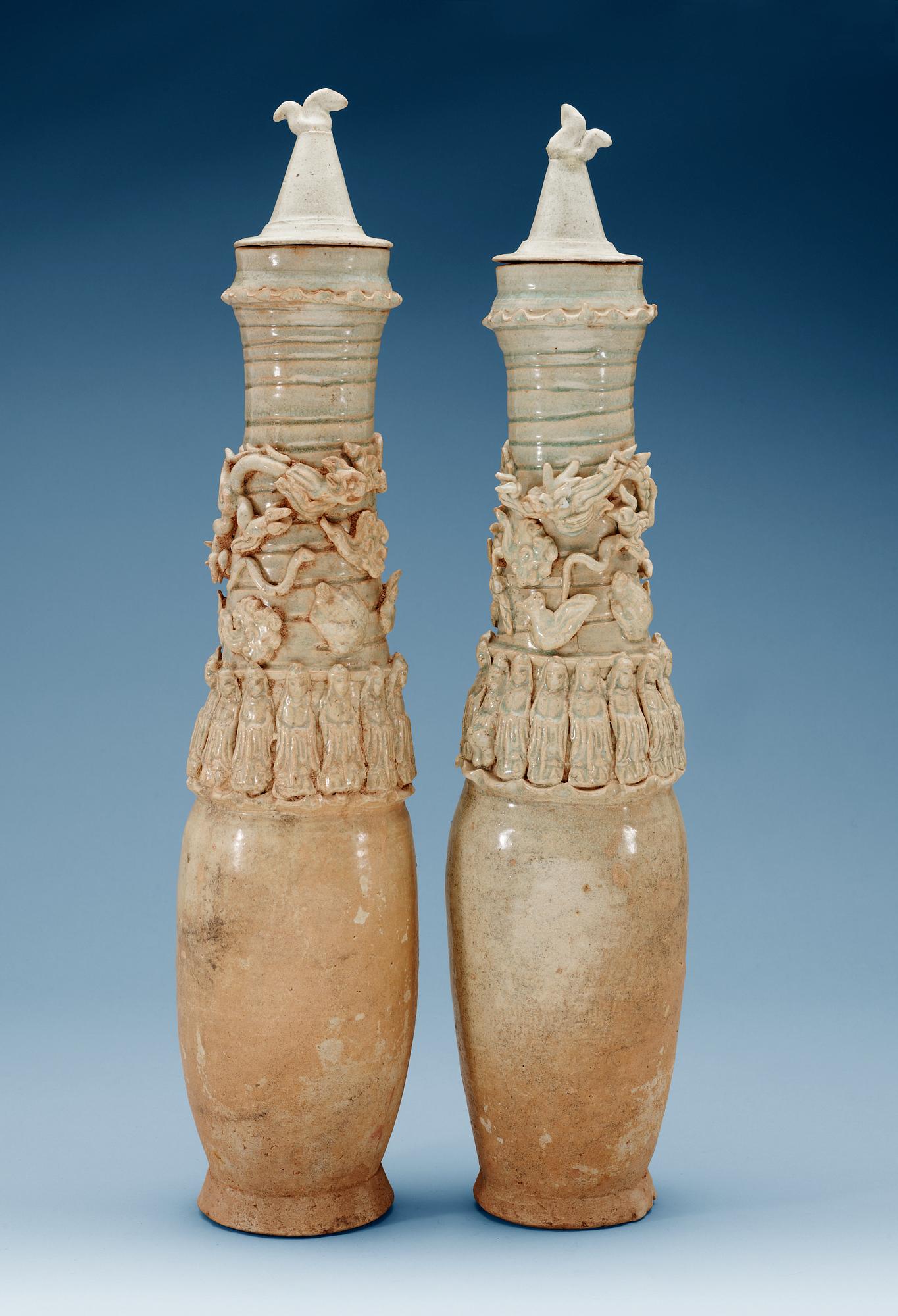 A set of two green glazed vases with covers, Yuan dynasty (1271-1368).