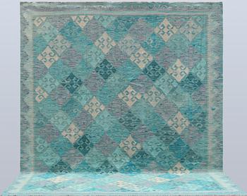 A Kelim carpet, c. 291 x 248 cm.