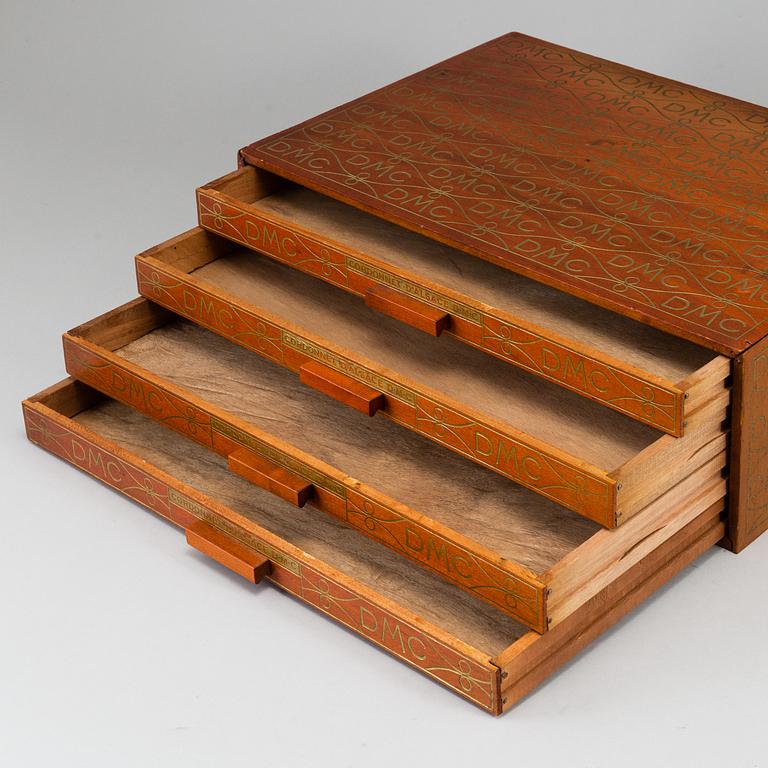 A wooden chest of drawers/box, France, DMC, 20th Century.