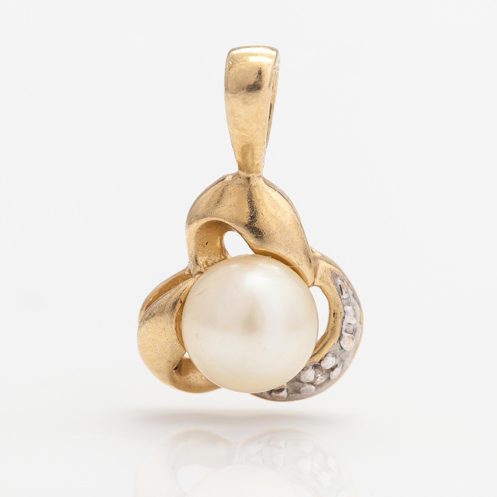 A 14K gold pendant with a cultured pearl and a diamond ca. 0.005 ct.