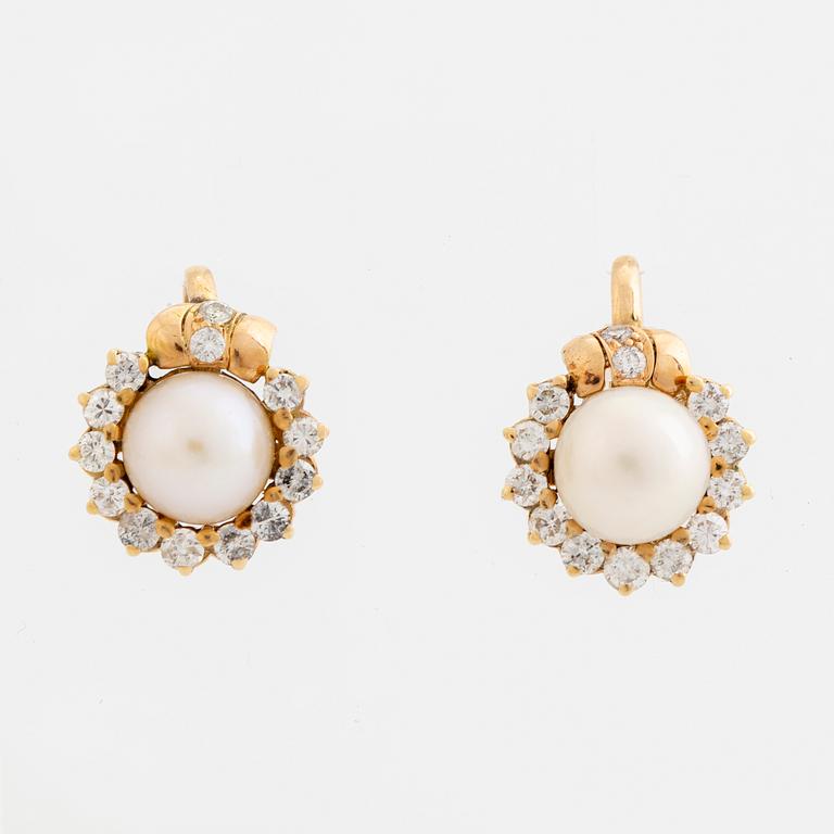 Cultured pearl and brilliant cut diamond earrings.