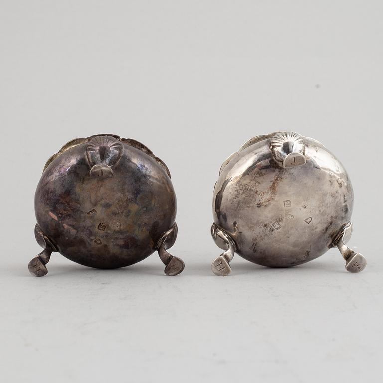 Two pairs of English 18th century silver salt-cellars, marked in London 1762 and 1769.